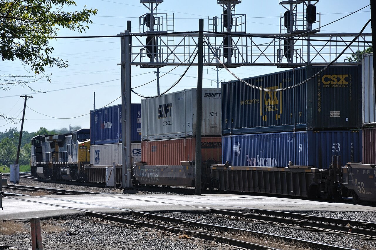CSX double-stack intermodal freight train passing through Dolton, Illinois