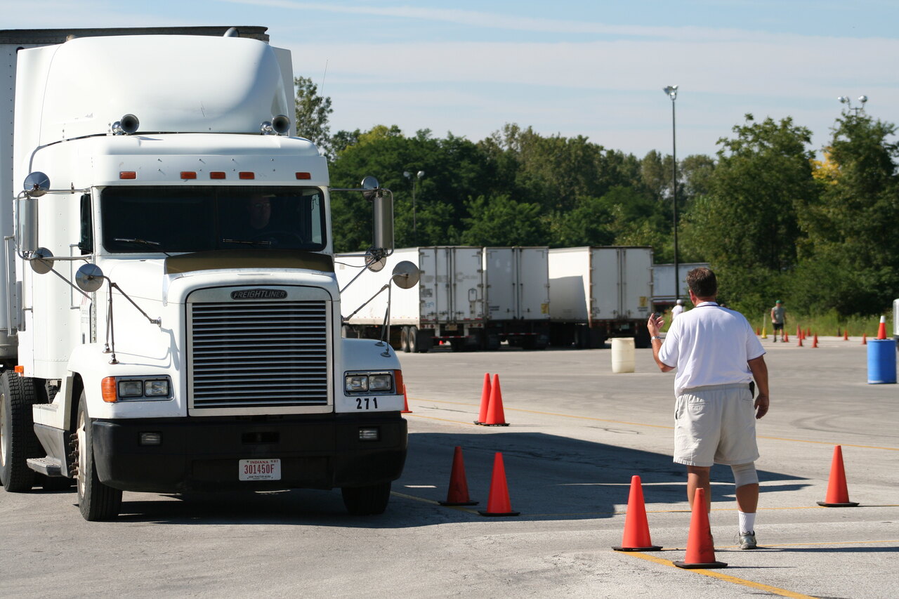 Tractor-trailer practicing maneuvers on a commercial driver's license training range